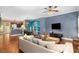 Open-concept living room with hardwood floors, stylish furnishings, and seamless flow to the kitchen at 396 15Th Nw St # 6, Atlanta, GA 30318