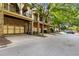 A row of attractive townhomes, each featuring a two-car garage and charming covered porch at 396 15Th Nw St # 6, Atlanta, GA 30318