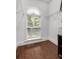 Walk-in closet includes an arched window that provides natural light and wire shelving for storage at 396 15Th Nw St # 6, Atlanta, GA 30318