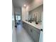 Modern bathroom featuring double vanity sinks, gray cabinets, and stylish fixtures at 4020 Sierra Knolls Ct, Cumming, GA 30040