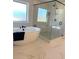 Modern bathroom featuring a soaking tub and glass shower at 4020 Sierra Knolls Ct, Cumming, GA 30040