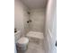 Contemporary bathroom with walk-in shower featuring beige tiling, matte black fixtures, and a plush rug at 4020 Sierra Knolls Ct, Cumming, GA 30040