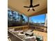 Outdoor patio with comfortable seating, ceiling fan, and scenic views of the surrounding landscape at 4020 Sierra Knolls Ct, Cumming, GA 30040