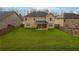 Expansive backyard showcases a lush lawn, enclosed by a wooden fence, offering ample space for recreation and relaxation at 5180 Mirror Lake Dr, Cumming, GA 30028
