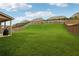 Expansive, well-maintained backyard with lush green grass and a privacy fence, perfect for outdoor activities at 5180 Mirror Lake Dr, Cumming, GA 30028