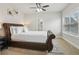 Bedroom featuring a leather bed, plush pillows, and a large window for ample natural light at 5180 Mirror Lake Dr, Cumming, GA 30028