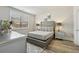 Bedroom featuring ample natural light, a large window, and tasteful decor at 5180 Mirror Lake Dr, Cumming, GA 30028