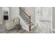 Staircase and entrance featuring sleek floors, neutral tones, and great natural light at 5180 Mirror Lake Dr, Cumming, GA 30028