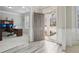 Inviting entryway boasts hardwood floors, wainscoting, and access to a home office, creating a welcoming first impression at 5180 Mirror Lake Dr, Cumming, GA 30028