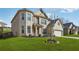 Charming two-story brick home with a well-manicured lawn and attached two-car garage at 5180 Mirror Lake Dr, Cumming, GA 30028