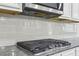 Well-equipped kitchen featuring granite countertops and a gas range at 5180 Mirror Lake Dr, Cumming, GA 30028