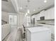Open kitchen with granite countertops, stainless steel appliances, and an island with seating at 5180 Mirror Lake Dr, Cumming, GA 30028