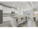 Open kitchen with granite countertops, stainless steel appliances, and an island with seating at 5180 Mirror Lake Dr, Cumming, GA 30028
