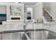 Stainless steel kitchen sink featuring granite countertop and modern chrome faucet at 5180 Mirror Lake Dr, Cumming, GA 30028