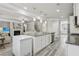 Open kitchen with granite countertops, stainless steel appliances, and an island with seating at 5180 Mirror Lake Dr, Cumming, GA 30028