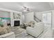 Cozy living room showcasing fireplace, staircase, and neutral colored furniture at 5180 Mirror Lake Dr, Cumming, GA 30028