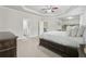 Comfortable Primary bedroom with tray ceiling, and a view to the staircase at 5180 Mirror Lake Dr, Cumming, GA 30028
