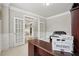 Stylish office space with double french doors leading into a comfortable living area at 5180 Mirror Lake Dr, Cumming, GA 30028