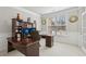 Bright office with a large window, a desk, and a bookcase at 5180 Mirror Lake Dr, Cumming, GA 30028