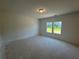 Spacious bedroom with two windows that offer ample natural light and a neutral color palette at 1006 Starmoss Lane, Conyers, GA 30094
