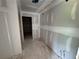 Unfinished hallway, awaits personalization with paint and flooring, leading to potential living areas at 1006 Starmoss Lane, Conyers, GA 30094