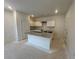 Kitchen featuring white cabinets, granite countertops, an island, and stainless steel appliances at 1006 Starmoss Lane, Conyers, GA 30094