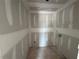 A well-sized laundry room is ready for washer and dryer hookups and shelving at 1006 Starmoss Lane, Conyers, GA 30094