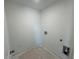 Laundry room with connections for a washer and dryer at 1006 Starmoss Lane, Conyers, GA 30094