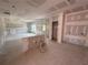 Unfinished living room boasts an open layout; ready for flooring, painting, and personalized finishes at 1006 Starmoss Lane, Conyers, GA 30094