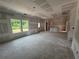 Unfinished living room with abundant natural light from large windows and flexible floorplan at 1006 Starmoss Lane, Conyers, GA 30094