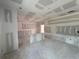 Unfinished living room showcases an open-concept design; ready for customization and personal design at 1006 Starmoss Lane, Conyers, GA 30094