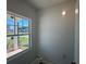 Bright, sunlit room featuring a large window showcasing exterior views and a neutral color palette at 1006 Starmoss Lane, Conyers, GA 30094