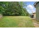 Well maintained backyard with mature trees at 11028 Southwood Dr, Hampton, GA 30228