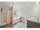 Bright bathroom featuring a separate shower and soaking tub and dual sinks at 11028 Southwood Dr, Hampton, GA 30228