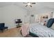 Spacious bedroom with ceiling fan, neutral walls, carpet flooring, and comfortable furnishings at 11028 Southwood Dr, Hampton, GA 30228