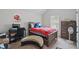 Well-lit bedroom with work desk, carpet flooring and view to the window with natural light at 11028 Southwood Dr, Hampton, GA 30228