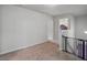 Hallway with carpet floors, neutral walls, and access to multiple rooms, creating a functional space at 11028 Southwood Dr, Hampton, GA 30228