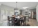 Spacious kitchen with stainless steel appliances, a large island, and a dining area by the patio door at 11028 Southwood Dr, Hampton, GA 30228