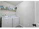 Cozy laundry room area with washer and dryer at 11028 Southwood Dr, Hampton, GA 30228