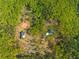 Aerial view shows two homesites surrounded by a forest landscape at 281 Abbott Dr, Canton, GA 30114