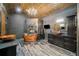 This opulent bathroom features a copper soaking tub, wood ceiling, and dark cabinets at 281 Abbott Dr, Canton, GA 30114