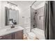 Modern bathroom with a vanity, bathtub with tile surround, and a view to the bedroom at 281 Abbott Dr, Canton, GA 30114