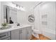 Well-lit bathroom featuring a modern vanity, subway tile, and bathtub at 281 Abbott Dr, Canton, GA 30114