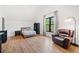 Bright bedroom with a bed, a view, and a comfortable leather recliner at 281 Abbott Dr, Canton, GA 30114