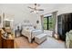 Bright bedroom with a metal bed frame, a window view, and an adjacent bathroom at 281 Abbott Dr, Canton, GA 30114