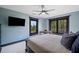 Bedroom featuring a bed, large windows with views, and a ceiling fan at 281 Abbott Dr, Canton, GA 30114