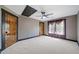 Spacious bedroom with neutral walls, plush carpet, ceiling fan, and natural light from window at 281 Abbott Dr, Canton, GA 30114