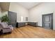 Bonus room with hardwood floors, gray cabinets, and a comfortable seating area at 281 Abbott Dr, Canton, GA 30114