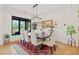 Elegant dining room boasts a wooden table, comfortable seating, and a view of the outdoors at 281 Abbott Dr, Canton, GA 30114