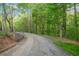 Gated gravel driveway at 281 Abbott Dr, Canton, GA 30114